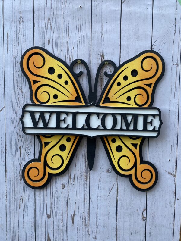 Welcome sign with a butterfly