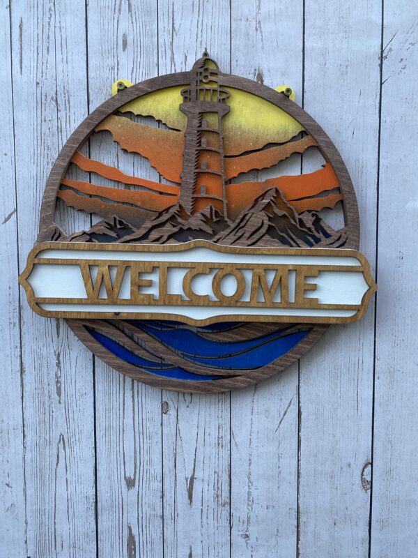 Welcome sign with a lighthouse